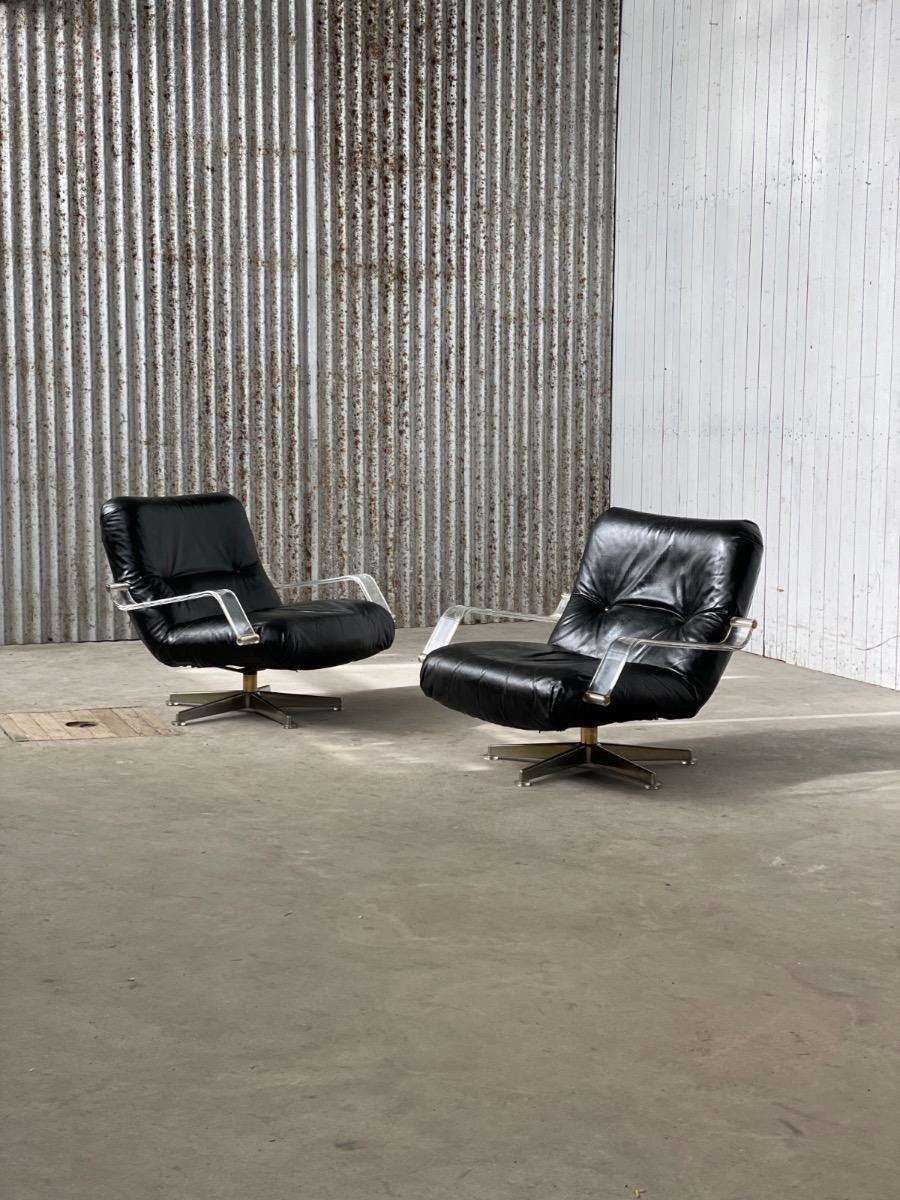 Pair space age black leather and plexiglass swivel chairs 1970s