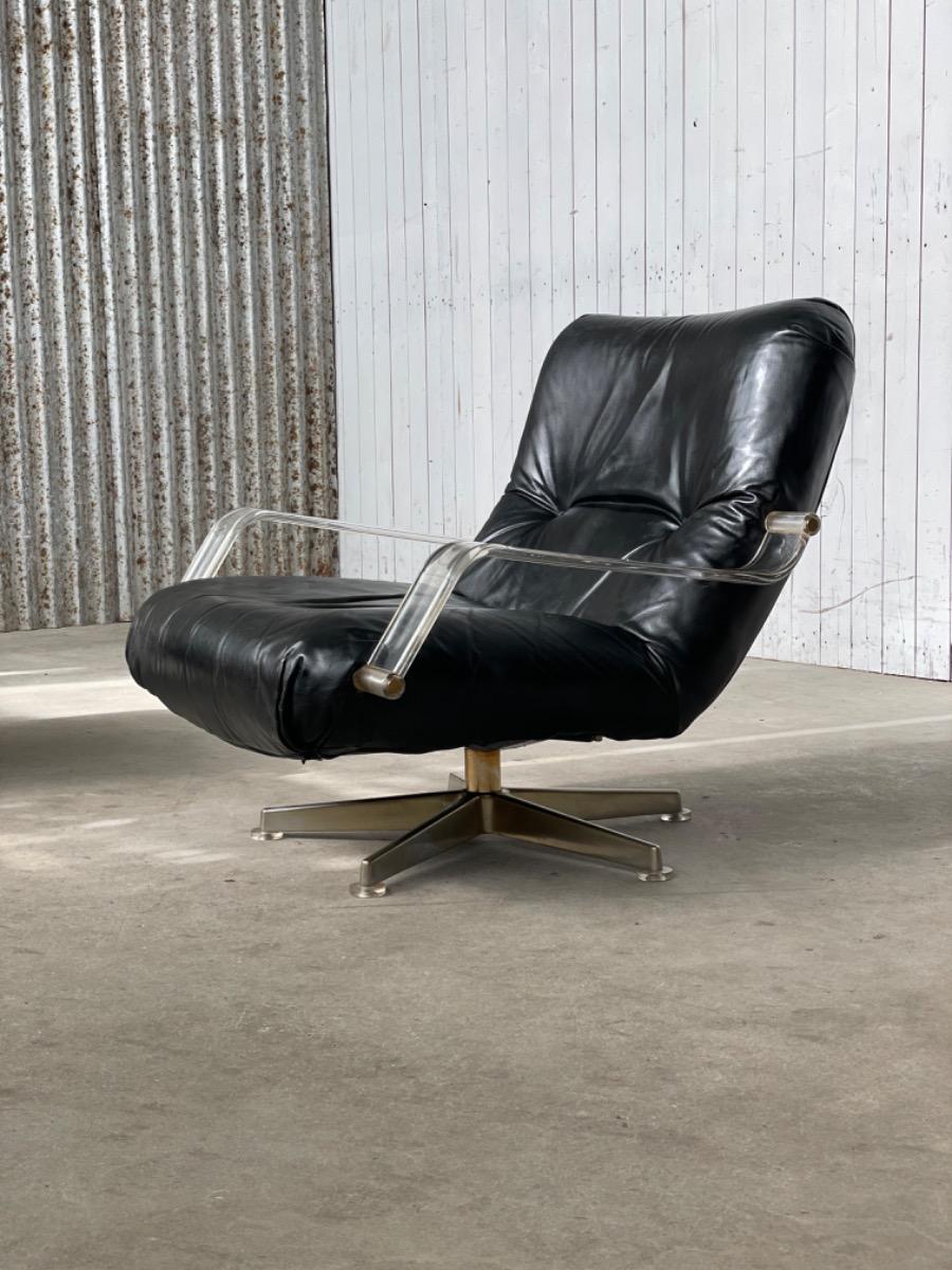 Pair space age black leather and plexiglass swivel chairs 1970s