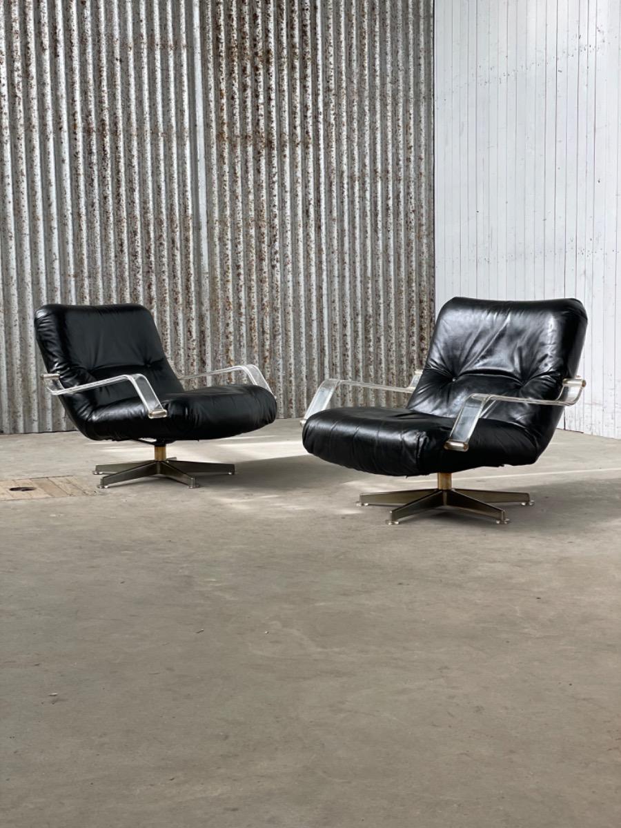 Pair space age black leather and plexiglass swivel chairs 1970s