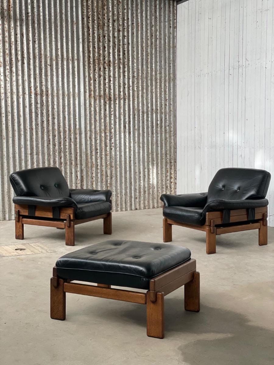 Set Brutalist oak armchairs in Black leather with ottoman, 1960