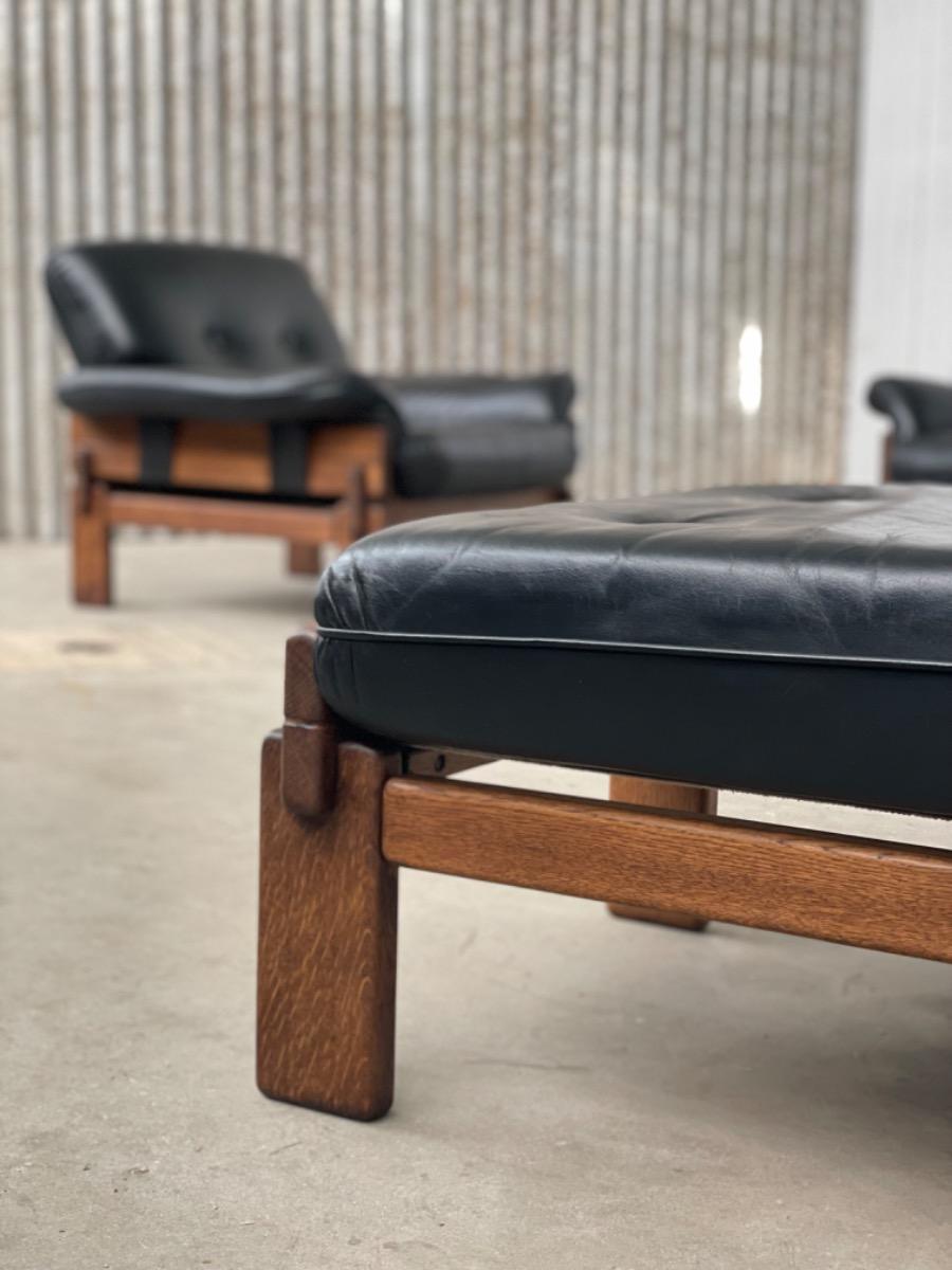 Set Brutalist oak armchairs in Black leather with ottoman, 1960