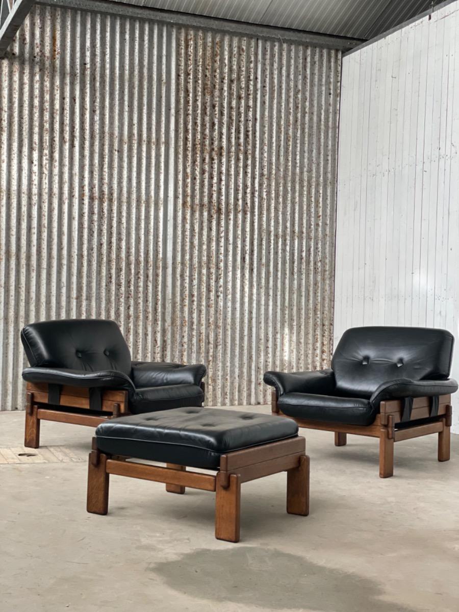 Set Brutalist oak armchairs in Black leather with ottoman, 1960