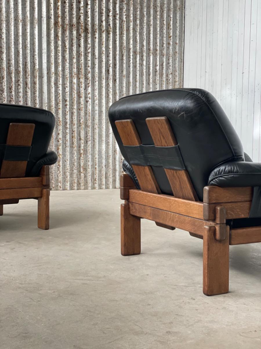 Set Brutalist oak armchairs in Black leather with ottoman, 1960