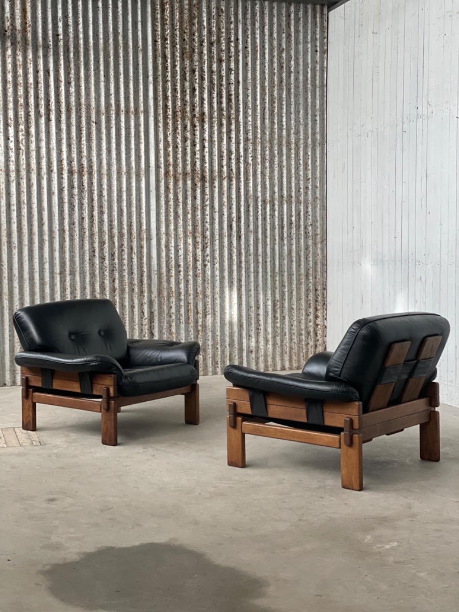 Set Brutalist oak armchairs in Black leather with ottoman, 1960