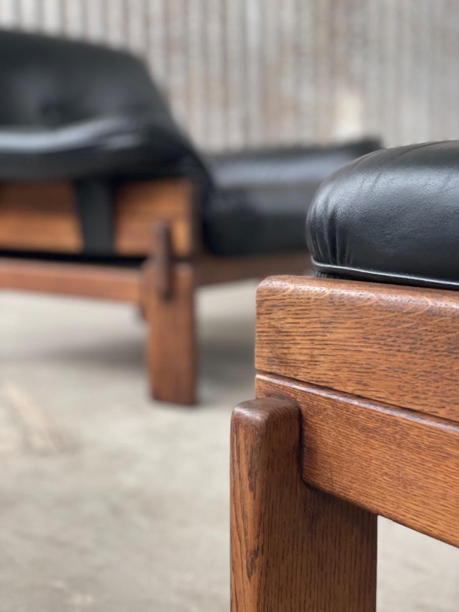 Set Brutalist oak armchairs in Black leather with ottoman, 1960