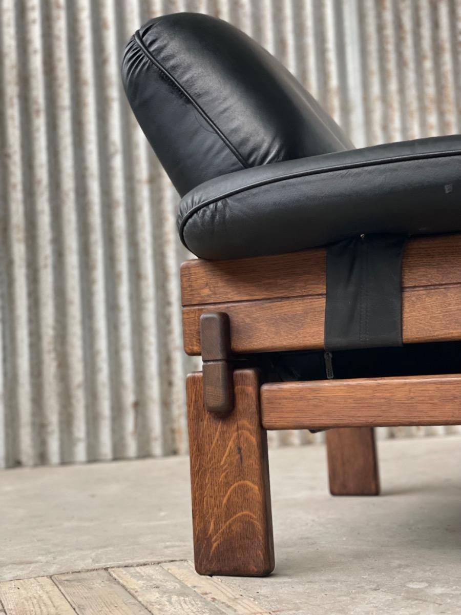 Set Brutalist oak armchairs in Black leather with ottoman, 1960