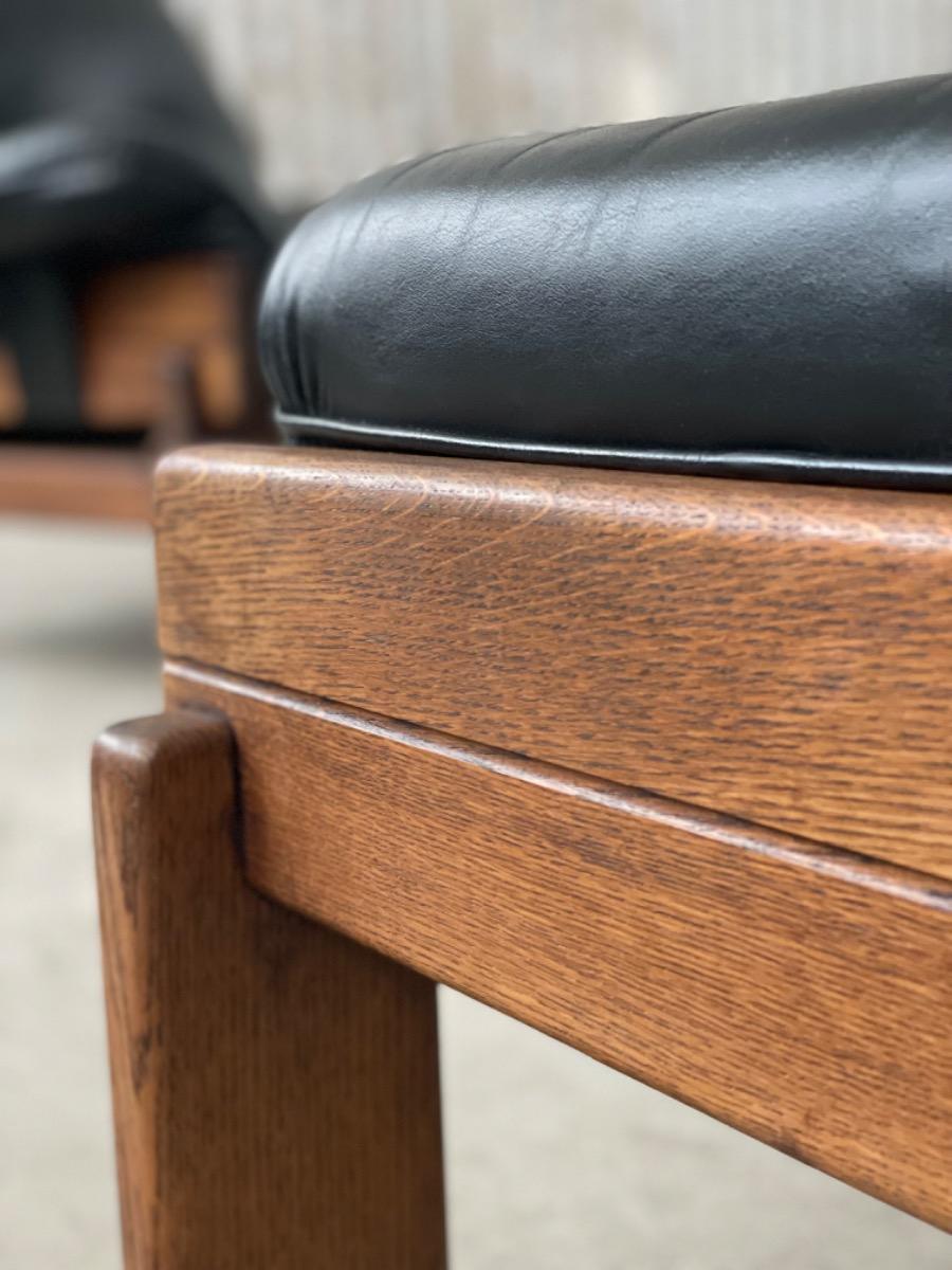 Set Brutalist oak armchairs in Black leather with ottoman, 1960