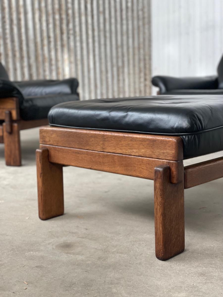 Set Brutalist oak armchairs in Black leather with ottoman, 1960