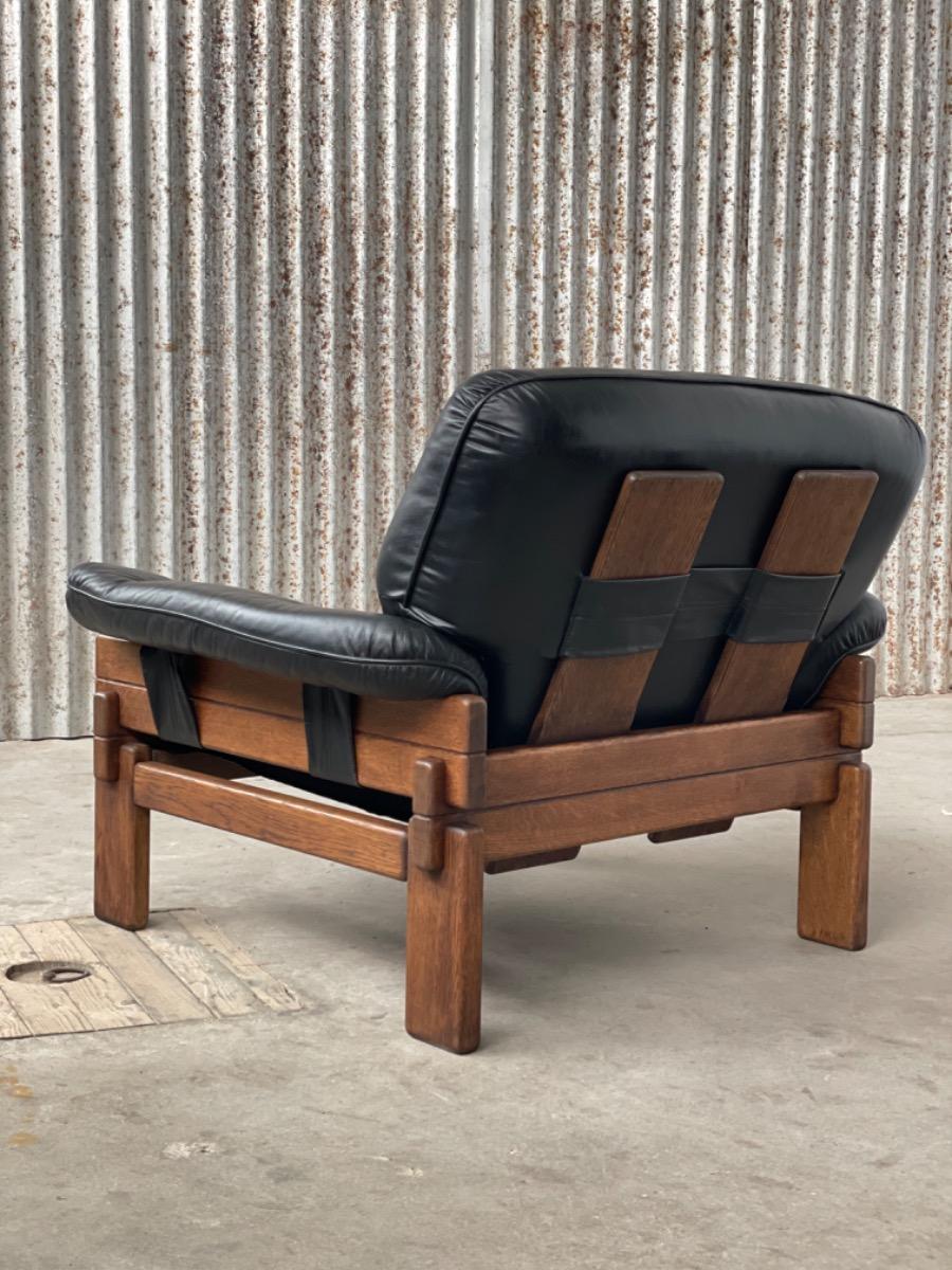 Set Brutalist oak armchairs in Black leather with ottoman, 1960