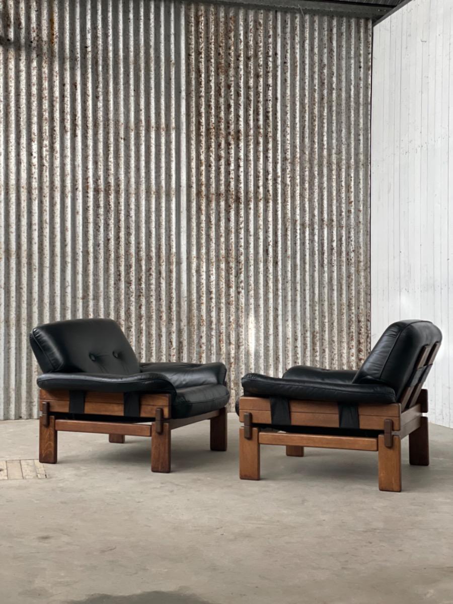 Set Brutalist oak armchairs in Black leather with ottoman, 1960